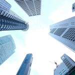 A striking upward view of various skyscrapers in an urban setting against a clear sky. — Eric Hollifield Atlanta 's Record-Se
