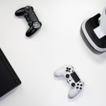 Flat lay of gaming console, controllers, and VR headset on a white background. — Find Secure and Verified Sources for TAG Gra