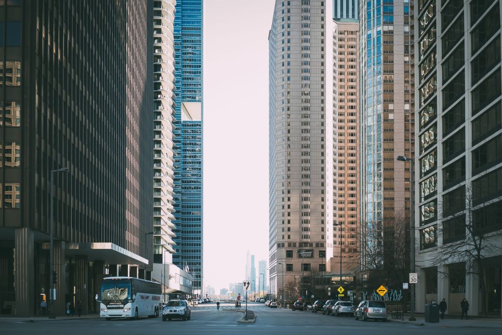 Vibrant city street scene with tall skyscrapers and city life full of cars and pedestrians. — From Tryouts to Triumph: Select