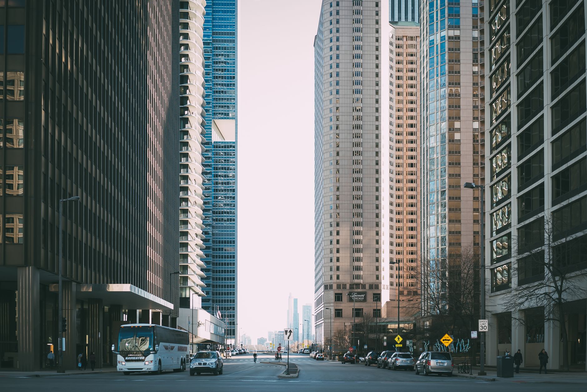 Vibrant city street scene with tall skyscrapers and city life full of cars and pedestrians. — From Tryouts to Triumph: Select