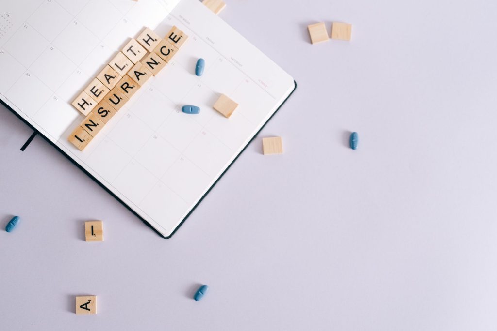 Flat lay of health insurance concept with planner and pills. — Pain Relief Naturally: The Therapeutic Advantages of HHC Vape