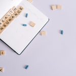 Flat lay of health insurance concept with planner and pills. — Pain Relief Naturally: The Therapeutic Advantages of HHC Vape