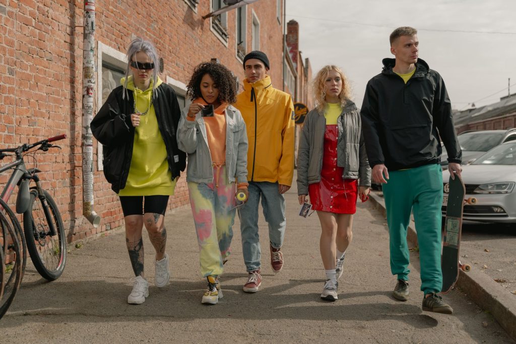 A group of stylish young adults walking together on a city street, showcasing modern fashion. — The Swiss Replica Watches for