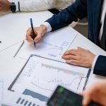 Professionals analyzing financial charts in a corporate setting. — Unlocking the Power of Korean Search Engine Optimization (