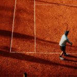 Overhead view of a tennis player on a clay court in Buenos Aires, Argentina. Vibrant and dynamic scene. — Watch MMA Fights Li